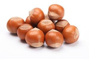 a pile of Hazelnuts sitting on top of each other isolated on white background photo