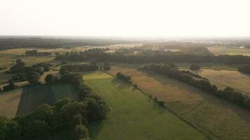 Aerial view of a rural landscape with trees and fields video