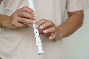 Hands of a musician playing the flute. Musical instrument. Concept, love music. Melody therapy, make concentration. Man practice to play music for being professional flutist photo