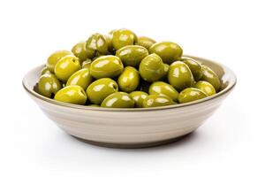 a bowl of green olives on a white background photo