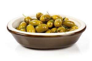 a bowl of green olives on a white background photo