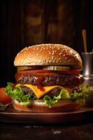 large hamburger on a wooden table photo