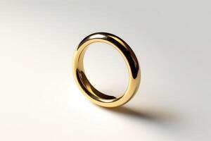 a gold wedding ring on a white background photo