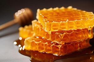 a close up of honeycombs with a wooden spoon photo