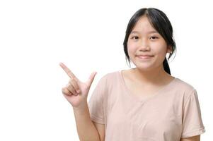 Portrait of attractive confident smiling asian girl directing attention empty space new advertisement photo