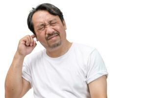 Bearded man has an itchy ear or a pain in his ear isolated on white background. photo