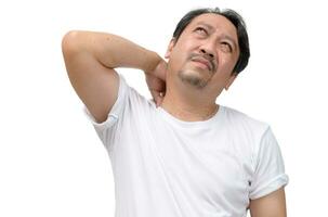 Middle aged man feel neck pain due to working in front of a computer for a long time isolated on white background photo