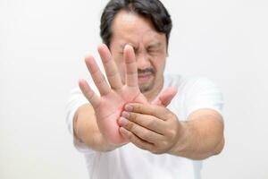 Pain in palm. middle age suffering his palm, man massaging sore zone, health care photo