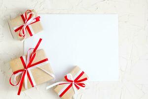 Christmas gifts with white blank greeting card photo