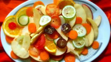 Colorful bowl of tropical fruit salad. photo