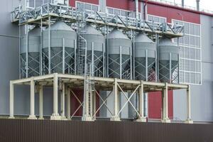 agro-processing plant for processing and silos for drying cleaning and storage of agricultural products, flour, cereals and grain photo