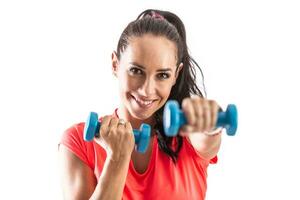 Detail of a pretty female trainer boxing with weights towards the camera and smiling photo