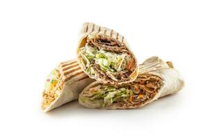 Chicken and veal isolated tortillas wrap looking tasty and served with juicy vegetables photo