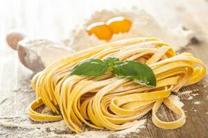 Preparation pasta Tagliatele from flour and eggs - Close-up photo