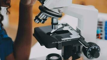 Medical or scientific researcher or man doctor looking at a test tube of clear solution in a laboratory video