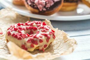 Sweet glazed donuts on table - Close up photo