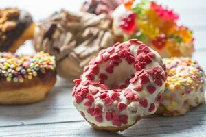 Sweet glazed donuts on table - Close up photo