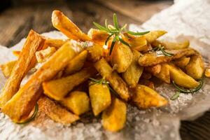 Potato Fries. Homemade potato fries with salt and rosemary photo