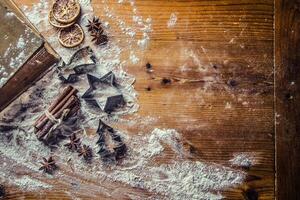 Top of view bakery table full of christmas aromatic ingredients photo