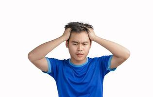 Young man touching his head and keeping eyes closed isolated on white background,  suffering from severe headache or migraine pain while working, crisis, problem, and mistake, Feeling stressed photo