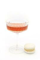 Macaroon and wine on a light background. photo