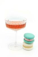 Macaroon and wine on a light background. photo