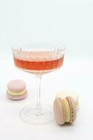 Macaroon and wine on a light background. photo