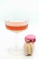 Macaroon and wine on a light background. photo