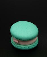 Macaroon on a black background. photo