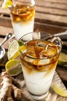 Dark n Stormy highball cocktail served as a long drink with rum, fresh lime juice, and ginger beer photo