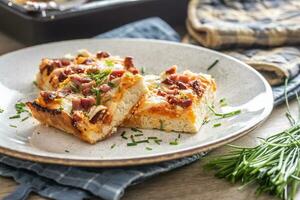 Slovak national dish podpecnik, podplamennik or posuch. Slovak national dish is made sourdough, bryndza, sour cream, bacon and onion photo