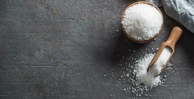 Crystaline sea salt in bowl and spoon - Top of view photo