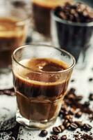 Coffee in glass cups mixed with cream and sprinkled coffee beans photo