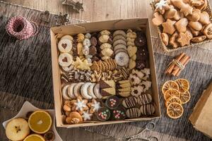 Box full of christmas sweet cokies and pastry photo