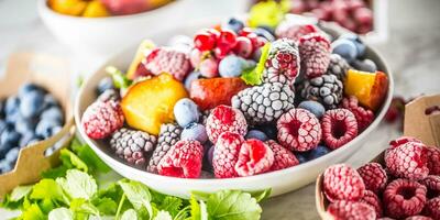 Frozen fruits blueberries blackberry raspberry red currant peach and herbs melissa photo