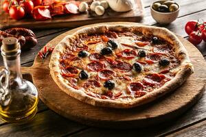 Pizza diavola traditional italian meal with spicy salami peperoni chili and olives photo