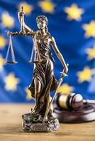 Lady Justice and European Union flag. Symbol of law and justice with EU Flag photo