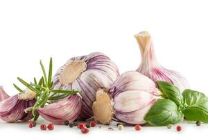 Garlic Cloves and Bulbs with rosemary and pepper. photo