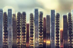 A pile of euro coins freely lying on the table. Close-up european money and currency photo