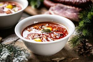 Traditional christmas sour cabbage soup with potatoes, sausage, smoked pork and mushrooms photo