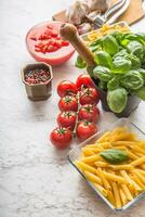 Italian ingredients pasta tomatoes basil spices and garlic photo