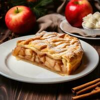 apple pie lies on a white plate on a wooden table. photo