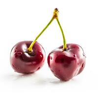 Sweet two ripe cherries isolated on white background photo