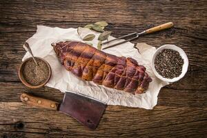 Pork meat.Pork chop smoked. Traditional smoked meat on oak wooden table in other positions. photo