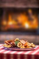 Festive garnished roast duck with apples and red cabbage photo