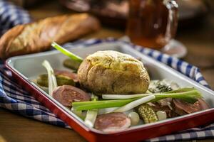 Pork tenderloin with baked potato photo