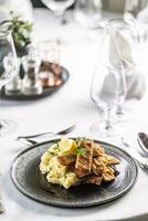 Orecchio d'elefante, Italian schnitzel, served cut in strips with potato salad photo