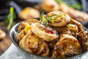 Pizza rolls stuffed with various ingredients, prosciutto bacon spinach basil mozzarella or parmesan cheese photo