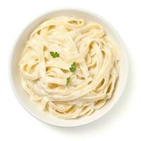 Bowl of fettucini alfredo isolated photo