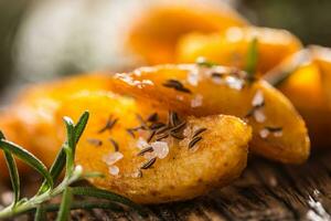 Potatoes. Roasted american potatoes with rosemary salt and cumin photo